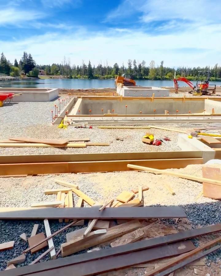 Wood forms and gravel base on a lakeside job site in Langley
