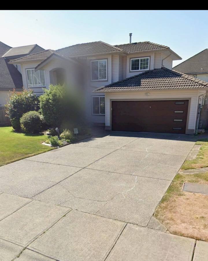 Finished concrete driveway in front of a house in Surrey
